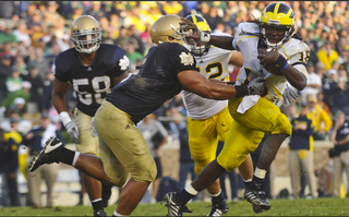 Illustration for article titled How A College Kid's Photograph Helped Launch Denard Robinson's Heisman Candidacy